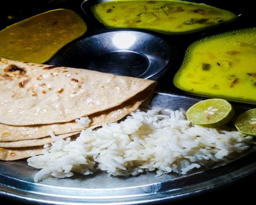 Healthy home cooked Indian thali meal with dal and roti